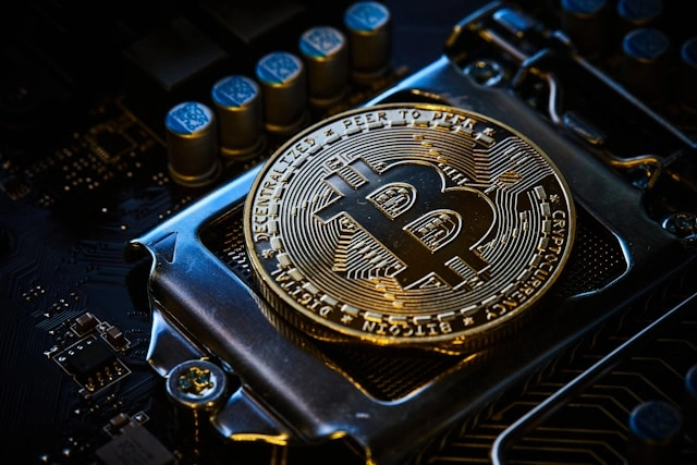 A bitcoin on top of a computer motherboard